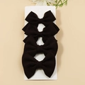 Set of 4 dark brown waffle textured fabric bow hair clips for girls on a white display card - Black