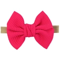Soft nylon baby headband with a large magenta checkered bow and elastic nude strap - Rose Red