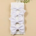 Set of four white waffle texture bow hair clips on display card for children - White