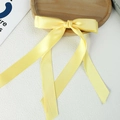 Elegant light yellow satin ribbon bow hair clip with long streamers for women - Egg Yellow