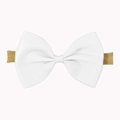 Close-up of white grosgrain bow headband featuring textured ribbon and elastic nude band - White