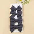 Set of four dark grey waffle weave bow hair clips for kids on a display card - Dark Gray
