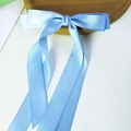 Elegant light blue satin long ribbon bow hair clip with smooth silk texture for girls - Blue