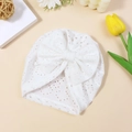 White eyelet fabric baby turban hat with a large bow and breathable floral cutouts - White