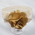 Close-up of baby headband with golden handmade ribbon flower and beige crochet lace - Style 9