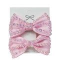 Pair of pink grosgrain bow hair clips with rainbow rhinestones on display card - One Pair / Pink