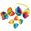 Close-up of a four-piece rainbow grosgrain ribbon bow set with headband and hair clips - Full Rainbow Gradient