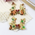 Pair of gold reindeer antler hair clips with colorful sequins and festive bell bows - Gold Sequin Bell Red Knot Style