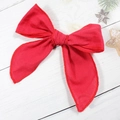 Handmade large red fabric Christmas hair bow clip with festive plaid edge and long ribbon - Solid Red Fabric Style