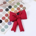 Dark red padded cotton bow charm for bags with long ribbons and a hanging hook - Red