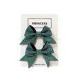 Set of two sparkly dark green sequin hair bows for girls on a white display card - Dark Green Style (#10)