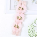 Pink lace baby headband with three delicate fabric roses and green leaf accents - Pink