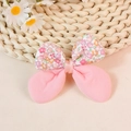 Floral print and solid pink fabric DIY bow accessory with center ribbon on woven mat - Watermelon red