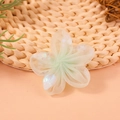 Pale green mesh flower hair accessory with iridescent sequins on woven background - Pale Green Heart Star Sequin Mesh Flower (#11)