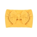 Bright yellow elastic nylon baby headband featuring a soft large handmade bow detail - Khaki/Earth Yellow