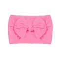 Soft nylon infant headband featuring a bright pink large handmade bow design - Pink