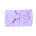 Soft pale purple nylon baby headband featuring a large handmade comfortable bow design - Purple