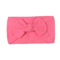 Soft nylon infant headband in bright pink color with a large decorative bow - Rose Red