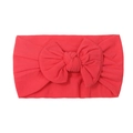 Soft nylon infant headband in vibrant coral red with a large handmade bow knot - Red