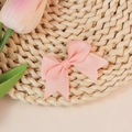 Pink grosgrain ribbon bow decoration for kids clothing and hair accessory on a straw mat - Pale Pink (#9)