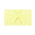 Soft nylon infant headband with a large handmade bow in pale yellow color - Bright Yellow