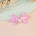 Pink sequined mesh butterfly bow accessory with a large central faux pearl embellishment - Sequin Pink (#14)
