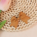 Handmade caramel grosgrain ribbon bow hair clip on a woven straw mat background - Light Brown (#24)