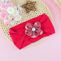Elastic baby nylon headband featuring a large red organza flower and pearl center - Red