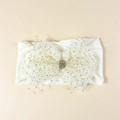 Cute nylon baby headband with a large sequined mesh flower bow in cream and gold - Off White