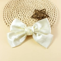 Elegant cream satin bow hair accessory with smooth silk texture and vintage style - Milk White