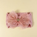Pink nylon baby headband featuring a large mesh bow with sparkling golden sequins - Pink