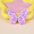 Detailed close-up of a purple sequined double-layer butterfly accessory with a teardrop gem - Purple (Purple/Yellow/Pink Combination)