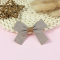 Linen texture gray bow hair accessory with brown center on white woven background - Gray Linen Texture (#19)