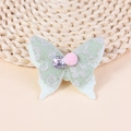 Hellgrünes Schmetterlings-Haaraccessoire aus Jacquard mit rosa Bommel und Schmuckstein - Hellgrün (#3)