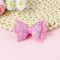 Dettaglio di fiocco a farfalla con paillettes rosa e polvere glitterata per fai-da-te - Rosa