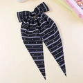 Polka dot and stripe patterns on a long ribbon bow hair clip in black and white colors - Black