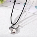 Close-up of magnetic heart-shaped pendant set with black cord and silver chain links - Matte Grey (Leather Rope) Matte Silver (Silver Chain)