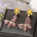 Detail of butterfly earrings with gold frame and pink dried flowers in resin - Pink Butterfly Stud Earrings