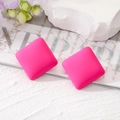 Macro shot of rose pink matte square stud earrings on a minimalist decorative background - Rose Red