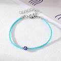 Detail of light blue beaded evil eye bracelet with silver lobster clasp and extender chain - Blue Beads with Silver Blue Eye