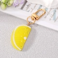 Realistic lemon slice keychain with textured yellow resin and golden swivel lobster clasp - Yellow Orange Slice Keychain