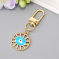 Portachiavi occhio del male rotondo in metallo dorato con dettagli blu e strass bianchi - Occhio Cavo Blu