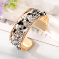 Detailed close-up of bohemian gold cuff bracelet with multi-color crushed stones - Silver Stone Bangle