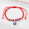 Adjustable red braided evil eye bracelet with blue heart charm and sparkling metal beads - Red Cord Blue Eye Heart
