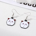 Detail of cute devil earrings with white enamel charms and red horns on Vogue magazine - White Dango Style (10# White Dango (Silver Hook))