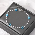 Pearl and blue Evil Eye beaded bracelet with silver metal chain and lobster clasp - Artificial Pearl Blue Eye Bracelet