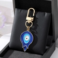 Vintage Evil Eye Schlüsselanhänger in Tropfenform mit Emaille und Gold-Verschluss - Goldrand Knospe Blaues Auge