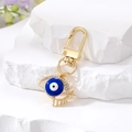 Llavero de ojo del diablo estilo étnico con esmalte colorido y diamantes de imitación - Ojo de Pestaña Hueca / Azul oscuro