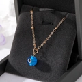 Golden bead chain necklace with blue Turkish Evil Eye pendant in a jewelry box - Sky Blue