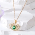 Collier vintage Evil Eye doré avec centre en émail vert et cils en cristaux brillants - Œil à Cils Vert